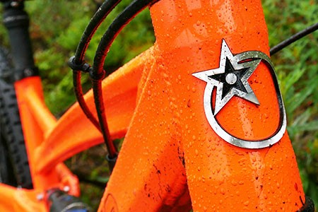 Close up frontal view of the frame on the Orange Five with the Orange logo on the front 